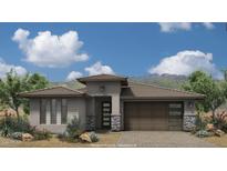 Modern Prairie-style home with a two-car garage and desert landscaping at 21435 W Meadowbrook Ave, Buckeye, AZ 85396