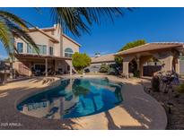 Inviting backyard pool with expansive patio and covered structure at 1313 W Glenmere Dr, Chandler, AZ 85224