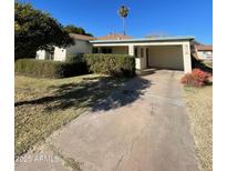 Charming one-story home with a covered carport and manicured lawn at 178 W Harrison St, Chandler, AZ 85225