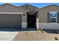 A lovely single-Gathering home featuring a two-car garage and desert landscaping in a tranquil setting at 22541 W Pontiac Dr, Surprise, AZ 85387