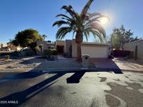 Single story home with desert landscaping and a two car garage at 26034 S Glenburn Dr, Sun Lakes, AZ 85248