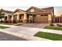 Craftsman style home with stone accents and a two-car garage at 3894 E Ebano St, Gilbert, AZ 85295