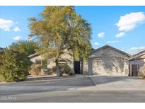 One-story house with a landscaped front yard and two-car garage at 40864 W Novak Ln, Maricopa, AZ 85138