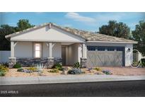 Single-story home with a two-car garage and front landscaping at 4101 S 176Th Dr, Goodyear, AZ 85338