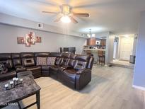 Spacious living room featuring recessed lighting, ceiling fan, and comfortable seating at 2121 W Union Hills Dr # 115, Phoenix, AZ 85027
