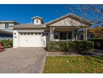 One-story home with a covered porch and attached two-car garage at 3146 E Sagebrush St, Gilbert, AZ 85296