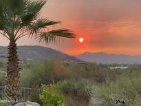 Stunning sunset view over mountain range at 37202 N Holiday Ln, Carefree, AZ 85377