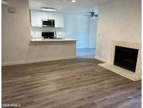 Living room features a fireplace and an open floor plan at 5236 W Peorioa Ave # 137, Glendale, AZ 85302