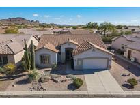 Single-story home with desert landscaping and a two-car garage, aerial view at 5363 S Emerald Desert Dr, Gold Canyon, AZ 85118