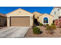 Single-story home with two-car garage and desert landscaping at 6492 W Sonoma Way, Florence, AZ 85132