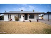 Charming single-story home with a front lawn and white brick exterior at 1410 E Bishop Dr, Tempe, AZ 85282