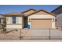 Single-story home with a two-car garage and a landscaped front yard at 17058 W Seldon Ln, Waddell, AZ 85355