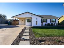 Charming single story home with landscaped lawn and modern curb appeal at 1860 S 24Th St, Mesa, AZ 85204