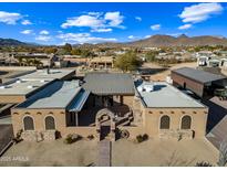 Aerial view of a large property with a main house and outbuildings at 37209 N 12Th St, Phoenix, AZ 85086