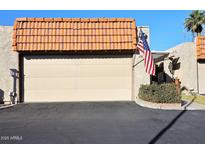 Attached garage with a Spanish-style tile roof at 5100 N Miller Rd # 20, Scottsdale, AZ 85250