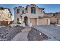 Two-story house with attached garage and landscaped front yard at 5227 W Desperado Way, Phoenix, AZ 85083