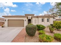 Beautiful single-story home with a two-car garage and well-manicured landscaping at 7846 W Adam Ave, Peoria, AZ 85382