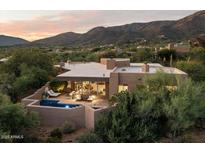 Luxury home with pool and patio, mountain backdrop at 10758 E Tamarisk Way, Scottsdale, AZ 85262