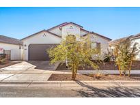 Single story home with two-car garage and drought-tolerant landscaping at 1135 E Westwood Dr, Casa Grande, AZ 85122