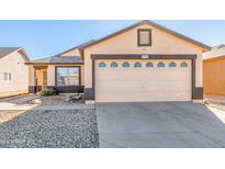 One-story house with a two-car garage and small front yard at 11793 W Larkspur Rd, El Mirage, AZ 85335