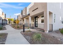 Modern townhome community with landscaped grounds at 2125 E Voltaire Ave, Phoenix, AZ 85022