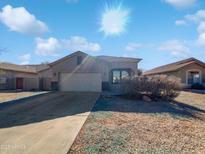 Single-story home with attached garage and desert landscaping at 3057 E Superior Rd, San Tan Valley, AZ 85143