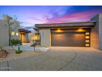 Stunning desert home boasts modern architecture, a three-car garage and xeriscaped yard at 39493 N 107Th Way, Scottsdale, AZ 85262