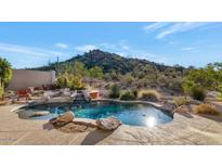 Luxury backyard oasis featuring a sparkling pool, spa, and mountain views at 7575 E Camino Salida Del Sol --, Scottsdale, AZ 85266