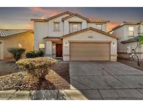 Two-story house with a two-car garage and landscaping at 8851 E Pampa Ave, Mesa, AZ 85212