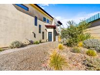 Modern home with a walkway leading to the front door and drought-tolerant landscaping at 1 Easy St # 12, Carefree, AZ 85377