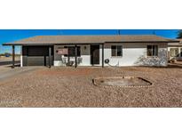 Cute single story home with a carport and small front yard at 1510 E Ironwood Dr, Buckeye, AZ 85326