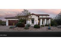 Beautiful two-story home with a landscaped front yard and a three-car garage at 29615 N 55Th Pl, Cave Creek, AZ 85331