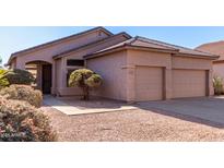 Two-car garage and attractive landscaping enhance this charming home's curb appeal at 3403 E Wyatt Way, Gilbert, AZ 85297