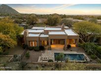 Luxury home with pool and desert landscaping; stunning mountain views at 9926 E Hidden Green Dr, Scottsdale, AZ 85262