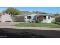 Cute ranch home with carport, mature landscaping, and mountain views at 11453 N 24Th Dr, Phoenix, AZ 85029