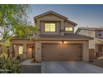 Two-story house with a brown door and garage at 12815 W Milton Dr, Peoria, AZ 85383