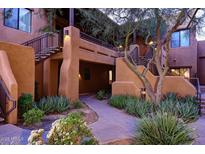 Spanish style building with walkway and landscaping at 13450 E Via Linda -- # 1010, Scottsdale, AZ 85259