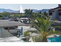 Community pool, fountain, and mountain views at 16616 E Palisades Blvd # 206, Fountain Hills, AZ 85268