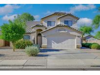 Two-story house with a two-car garage and landscaped front yard at 1799 E Erie St, Gilbert, AZ 85295