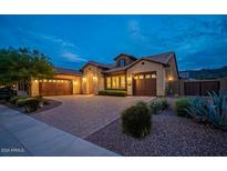 Stunning curb appeal! This home features a brick exterior, inviting landscaping and a welcoming front porch at 2915 E Constance Way, Phoenix, AZ 85042