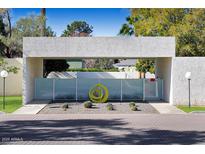 Contemporary architectural entry with a landscaped courtyard and modern gate at 4666 N 40Th St, Phoenix, AZ 85018