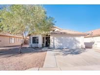 One-story home with a two-car garage and landscaped front yard at 5226 S 15Th St, Phoenix, AZ 85040