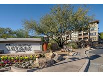 Gated community entrance with landscaping and signage at 5350 E Deer Valley Dr # 4434, Phoenix, AZ 85054