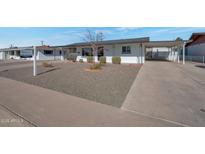 Charming single story home with well-maintained front yard and driveway at 5490 E Boise St, Mesa, AZ 85205