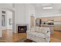 Bright living room with fireplace and hardwood floors at 7297 E Black Rock Rd, Scottsdale, AZ 85255