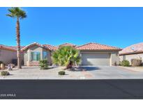 Single-story home with desert landscaping and two-car garage at 9 N Agua Fria Ln, Casa Grande, AZ 85194