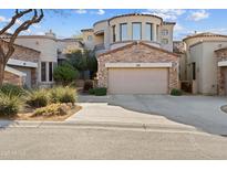 Beautiful two-story home with stone accents and a two-car garage at 19550 N Grayhawk Dr # 1101, Scottsdale, AZ 85255