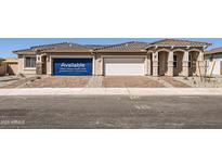 Charming single-Gathering home featuring a three car garage and a well-manicured front yard in a suburban neighborhood at 24914 N 173Rd Ln, Surprise, AZ 85387