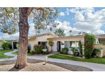 Attractive mid-century home with landscaped yard and walkway at 4800 N 68Th St # 384, Scottsdale, AZ 85251