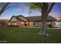 Charming home with a well-manicured lawn and mature trees, creating great curb appeal at 8366 S Grandview Ave, Tempe, AZ 85284